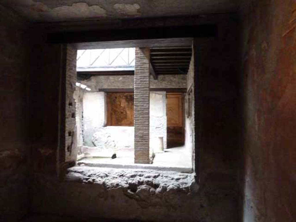 IX.13.1-3 Pompeii. May 2010. Room 25, looking north through window into kitchen courtyard, towards room 22.