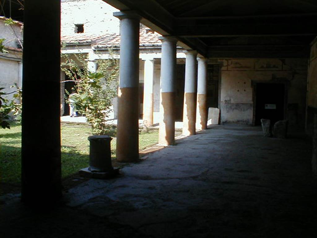 IX.13.1-3 Pompeii. September 2004. Room 9, looking north along east portico.