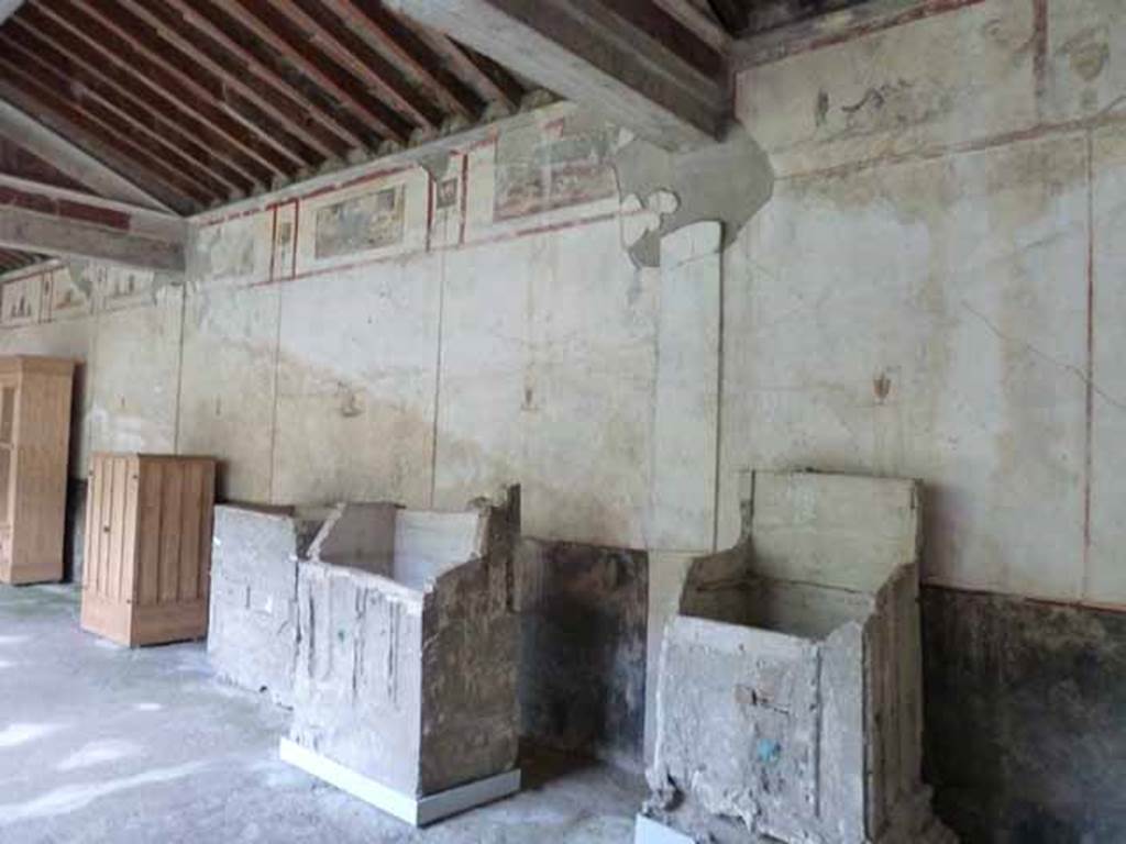 IX.13.1-3 Pompeii. May 2010. Room 9, east wall of portico and plaster casts of cupboards.