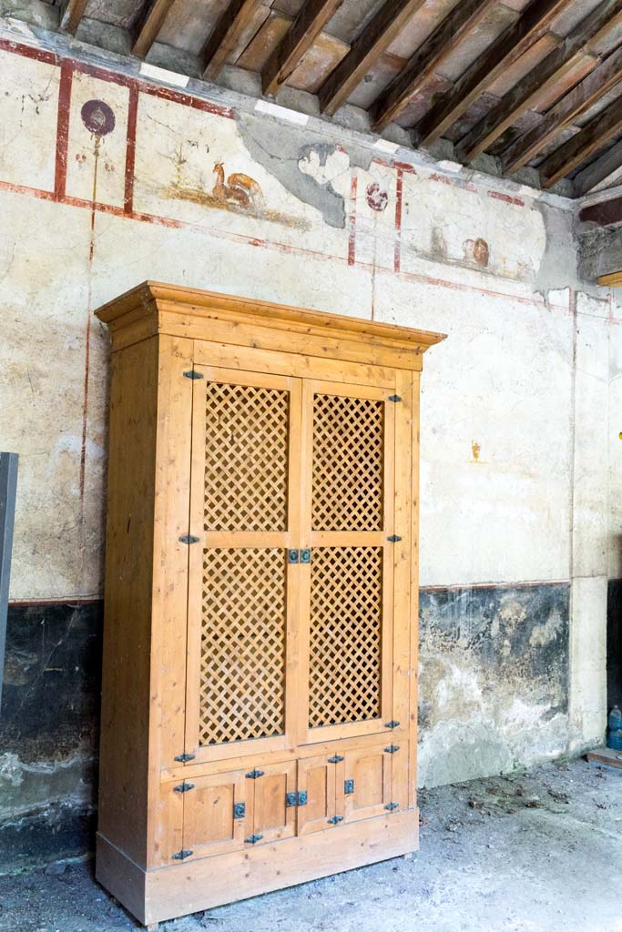 IX.13.3 Pompeii. October 2021. Room 9, reproduction cupboard against east wall. Photo courtesy of Johannes Eber.