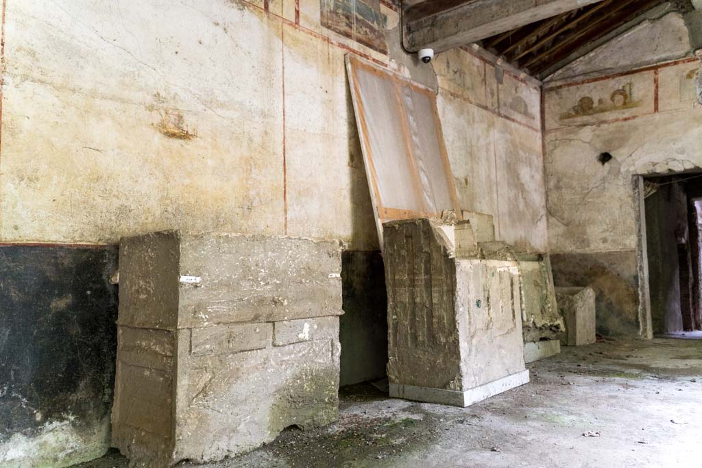 IX.13.3 Pompeii. October 2021.
Room 9, plaster casts of cupboards or chests against east wall of portico in south-east corner. Photo courtesy of Johannes Eber.