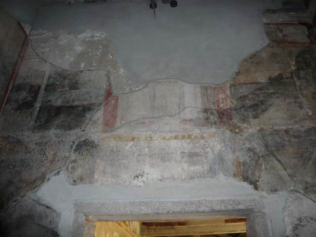 IX.13.1-3 Pompeii. May 2012. Room 10, upper south wall above doorway to peristyle.
Photo courtesy of Buzz Ferebee.