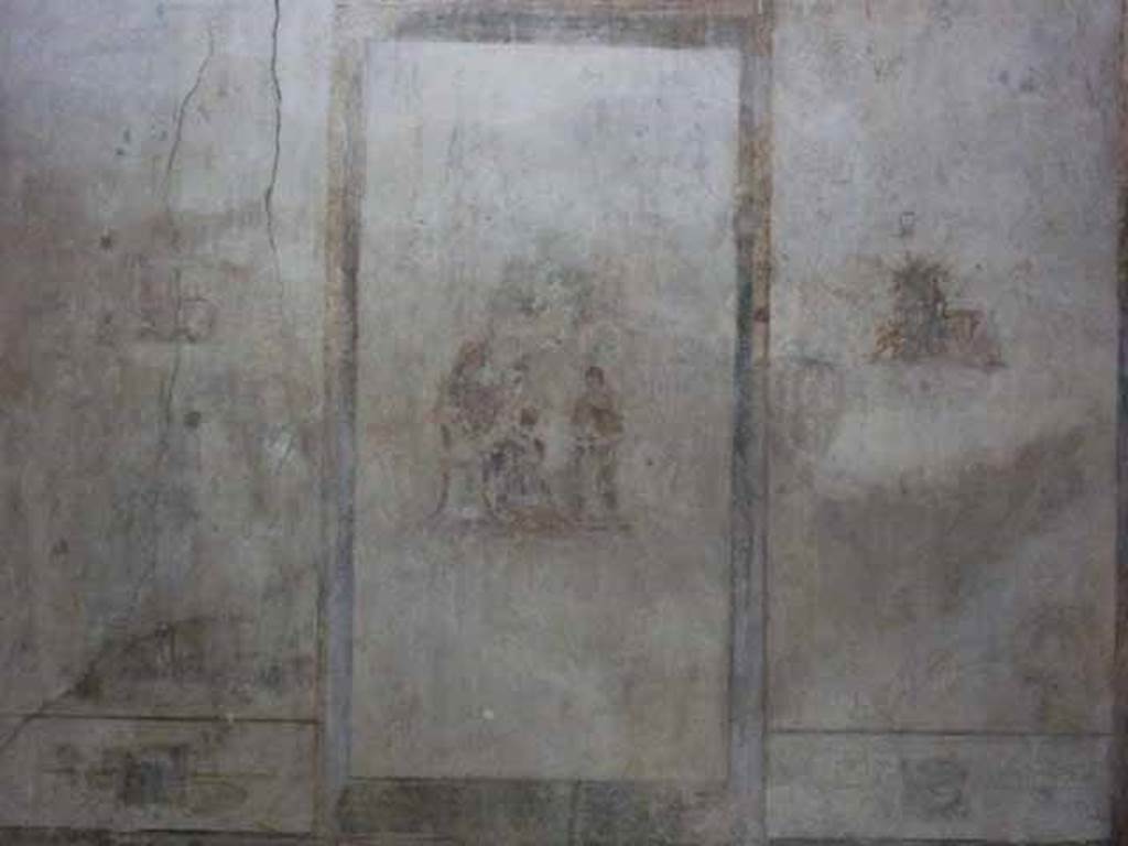 IX.13.1-3 Pompeii. May 2010. Room 12, detail from north wall of paintings in three panels.