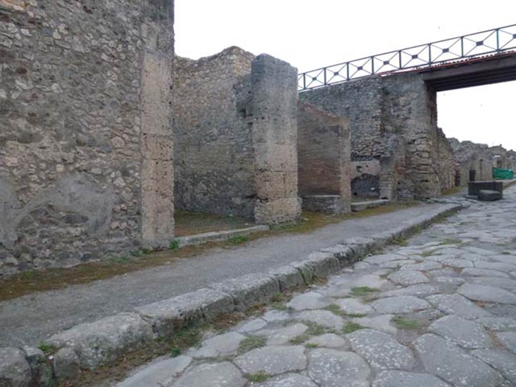 IX.14.3 Pompeii. September 2011. Looking south-west towards entrance doorway, on left, and IX.14.2 and IX.14.1, and modern bridge on Via di Nola. Photo courtesy of Michael Binns.