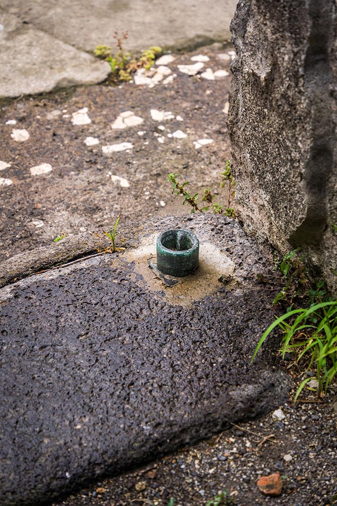 IX.14.4 Pompeii. July 2024.
Room 30, lava threshold at south end. Photo courtesy of Johannes Eber.