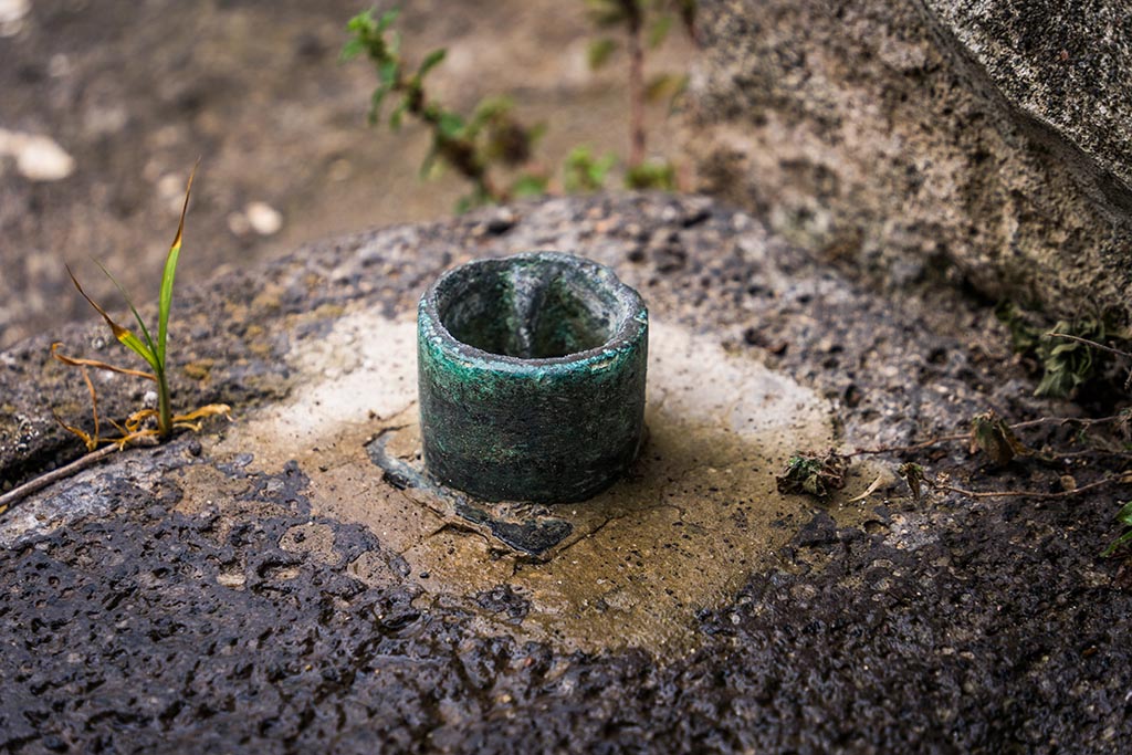 IX.14.4 Pompeii. July 2024. Room 30, detail from south end of lava threshold. Photo courtesy of Johannes Eber.