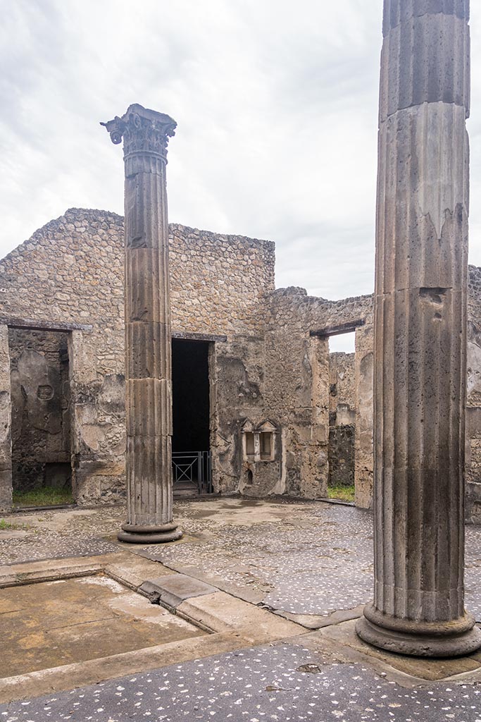 IX.14.4 Pompeii. July 2024.
Looking north-west across atrium towards Aedicula Lararium. Photo courtesy of Johannes Eber.