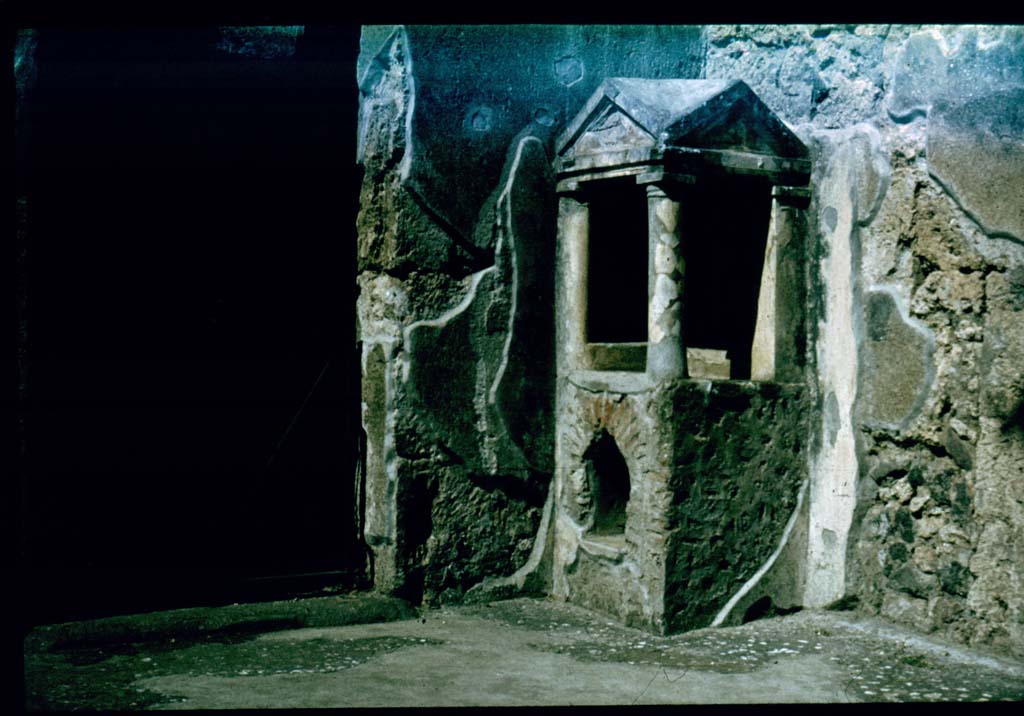 IX.14.4 Pompeii. Household lararium shrine 32 in atrium B.
Photographed 1970-79 by Günther Einhorn, picture courtesy of his son Ralf Einhorn.