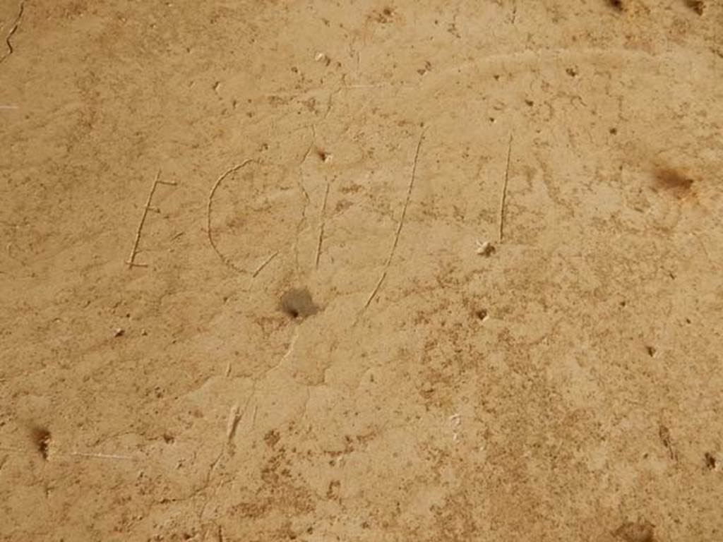 IX.14.4 Pompeii. May 2017. Graffito under the staircase on north side of peristyle.
This reads Ecisi.
Photo courtesy of Buzz Ferebee.