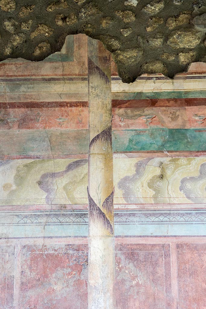 IX.14.4 Pompeii. July 2024.
Tablinum, detail of painted decoration on east wall. Photo courtesy of Johannes Eber.