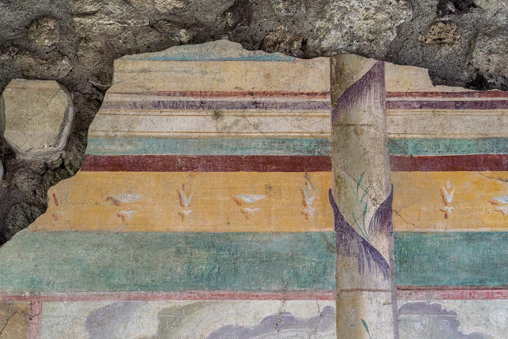 IX.14.4 Pompeii. July 2024. Tablinum, detail of painted decoration from centre of west wall. Photo courtesy of Johannes Eber.