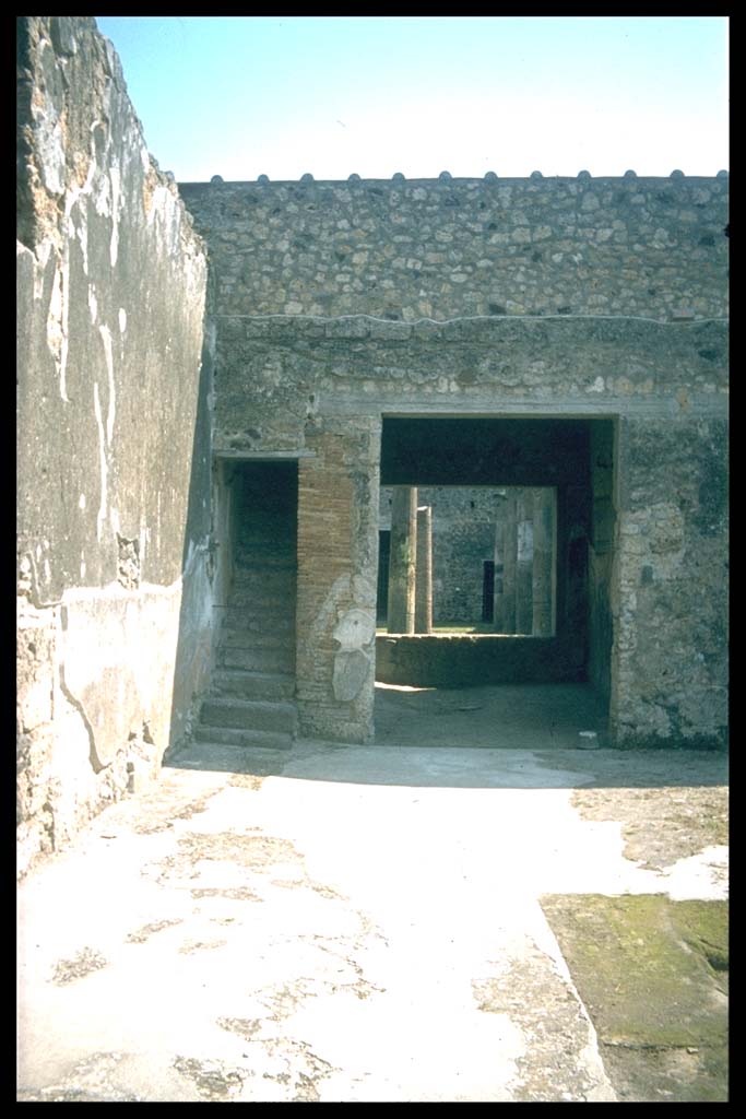 IX.14.4 Pompeii. Room 27, secondary atrium of IX.14.2, looking south through tablinum 19.
Photographed 1970-79 by Günther Einhorn, picture courtesy of his son Ralf Einhorn.