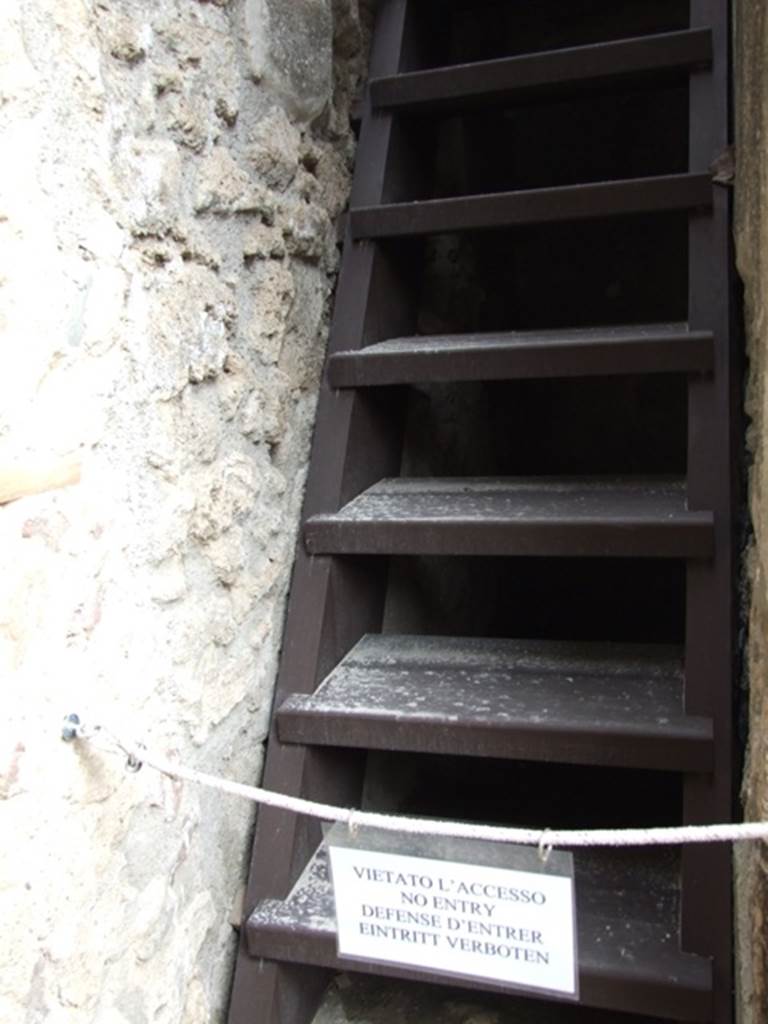 IX.14.4 Pompeii. December 2007. Modern example of ancient wooden staircase in room 35 on north-east side of atrium at IX.14.2. This wooden staircase would have been found in a narrow space between two walls in room 31.

