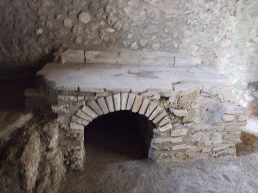 IX.14.4 Pompeii. December 2007. Room 18, looking north at hearth in kitchen. 
