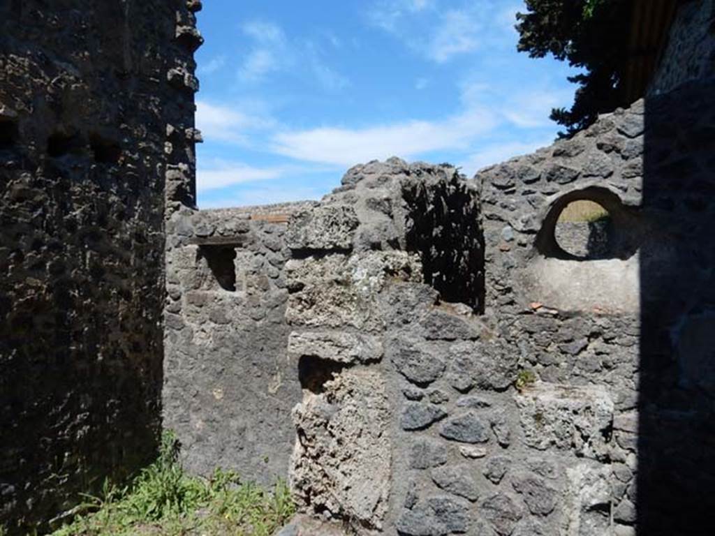 IX.14.4 Pompeii. May 2017.  Looking north-east from room 8, towards the latrine of room 8, on right, and east wall of the neighbouring room 7, on left.  Photo courtesy of Buzz Ferebee.
