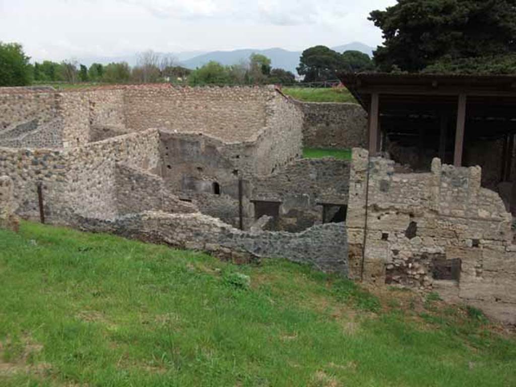 IX.14.b Pompeii, May 2010. Looking east at outside wall, with blocked entrance doorway.