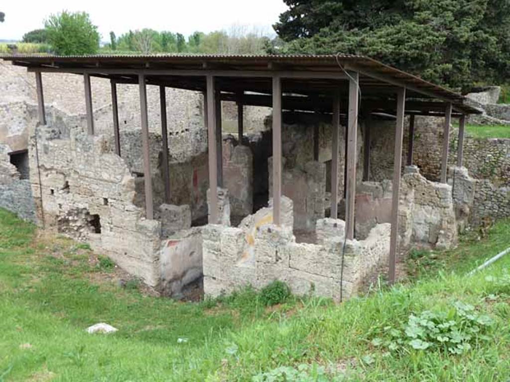 IX.14.c Pompeii. May 2010. Looking north-east. According to Spano, the construction of this house was very old. Its façade was formed entirely from large blocks of Sarno limestone. See Notizie degli Scavi di Antichità, 1911, p. 374.