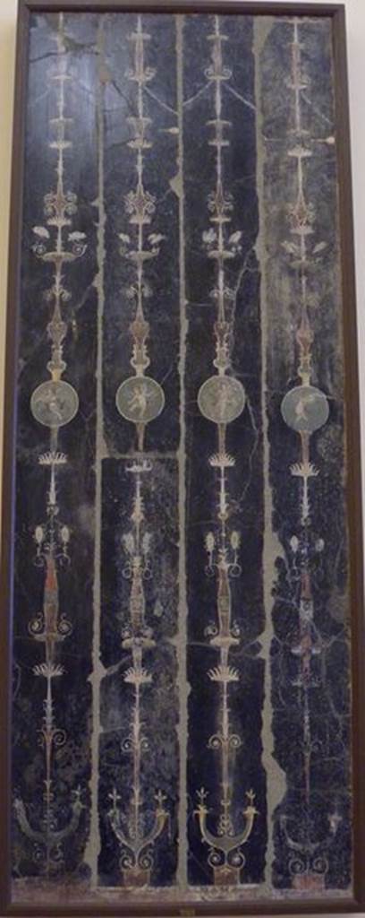 HGW06 Pompeii. Found in Triclinium on 18th May 1748. Wall painting of four candelabra with cupids showing the making of votive offerings. Now in Naples Archaeological Museum. Inventory number 9869.