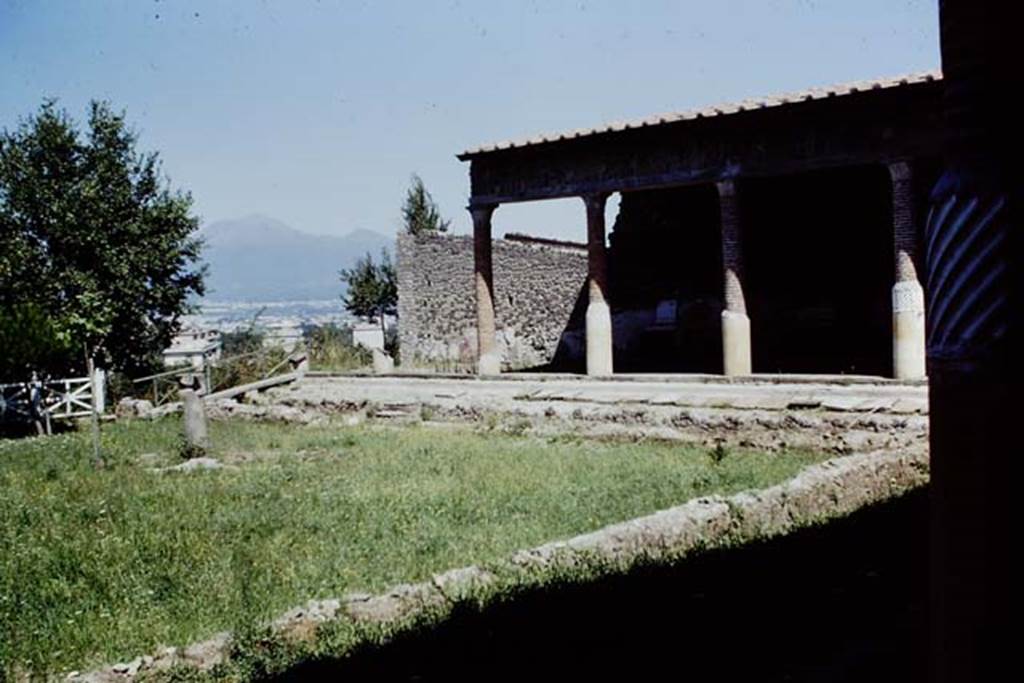 Villa San Marco, Stabiae, 1968. Area 66, garden peristyle area. Looking north towards the view to Vesuvius. Photo by Stanley A. Jashemski.
Source: The Wilhelmina and Stanley A. Jashemski archive in the University of Maryland Library, Special Collections (See collection page) and made available under the Creative Commons Attribution-Non Commercial License v.4. See Licence and use details. J68f1909
On the right one of the standing spirally fluted columns can be seen.