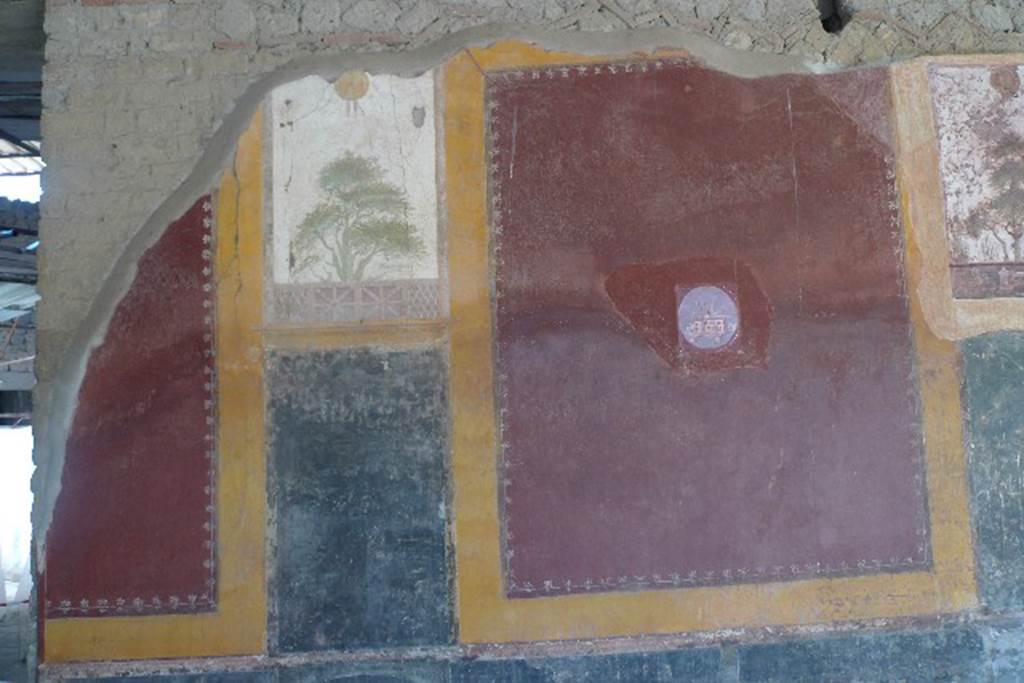 Castellammare di Stabia, Villa San Marco, July 2010. Room 20, east wall.
As part of the improvements to the villa, photo reproductions of some of the frescoes have been added to the wall. The reproduction medallion of a sea scene replaces one now in Naples Archaeological Museum, inventory number 9511. Photo courtesy of Michael Binns.