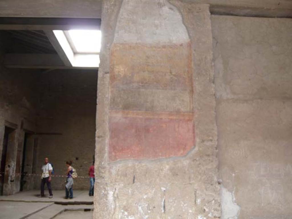 Villa of Mysteries, Pompeii. May 2012. Peristyle A, west wall with remains of wall decoration on north side of room 64, atrium entrance doorway.  Photo courtesy of Buzz Ferebee.
