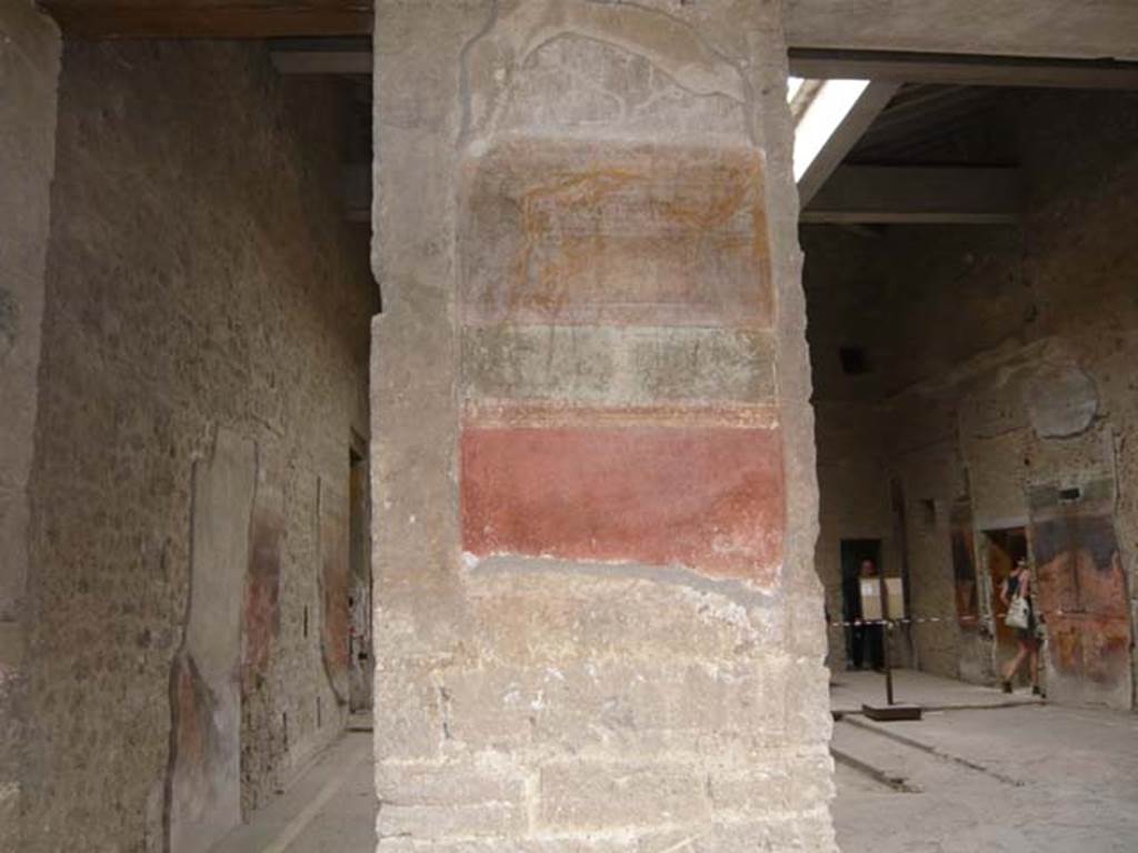 Villa of Mysteries, Pompeii. May 2012.  Peristyle A, west wall with remains of wall decoration on south side of atrium entrance doorway and north side of side door into atrium, on right. Photo courtesy of Buzz Ferebee.
