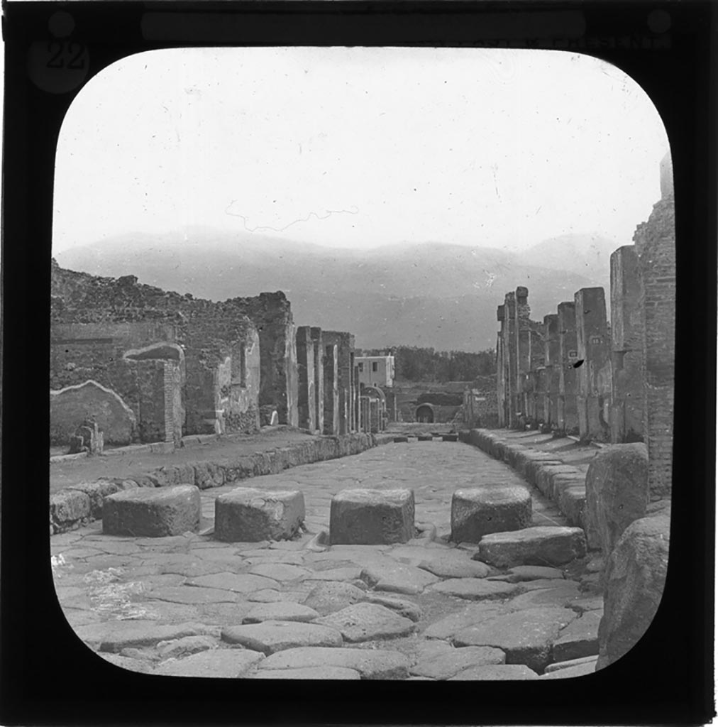 Via Stabiana, Pompeii. Glass lantern slide by York and Son, in or before 1890.
Looking south from Holconius crossroads, between I.4 on left, and VIII.4 on right.
Photo by permission of the Institute of Archaeology, University of Oxford. File name Passmorebx9im 029. Resource ID. 36561.
See photo on University of Oxford HEIR database
