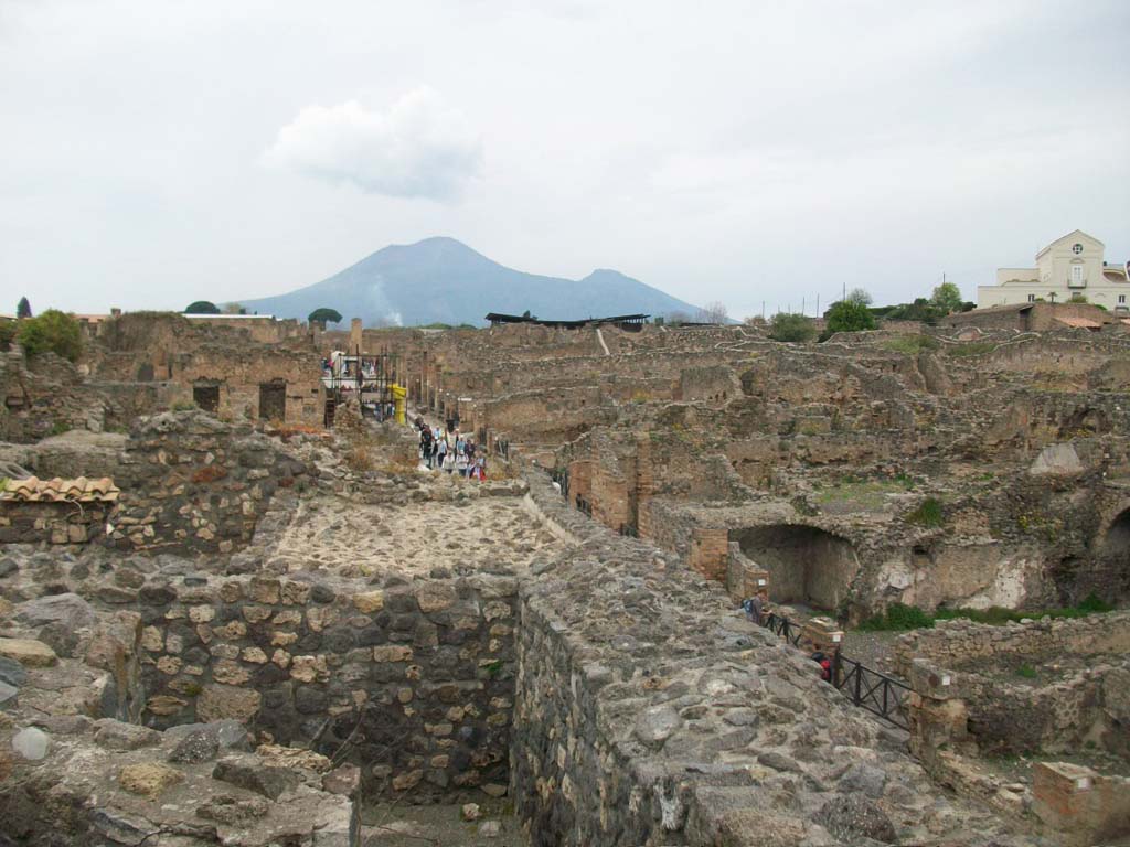 Via Stabiana, April 2010. Looking north from near upper peristyle area of VIII.7.24, centre left.
Reg. VIII.7. is on the left, and Reg. I.3. is on the right. Photo courtesy of Klaus Heese.