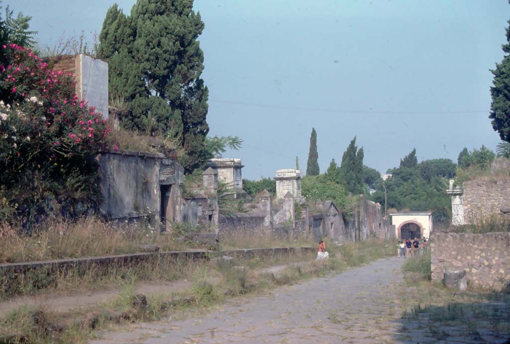 Via dei Sepolcri, Pompeii. 8th August 1976. Looking north along west side from near HGW17, on left. 
Photo courtesy of Rick Bauer, from Dr George Fay’s slides collection.
