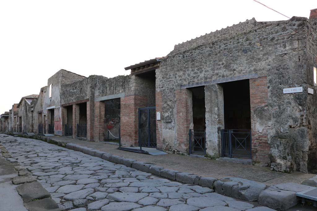 Via dell’Abbondanza, south side. December 2018. Looking east along north side of Insula I.6. Photo courtesy of Aude Durand.