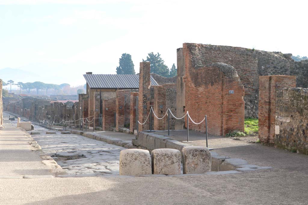 Via dell’Abbondanza, south side, Pompeii. December 2018.
Looking south-east, from east side of Forum, towards north side of Insula VIII.3. Photo courtesy of Aude Durand.