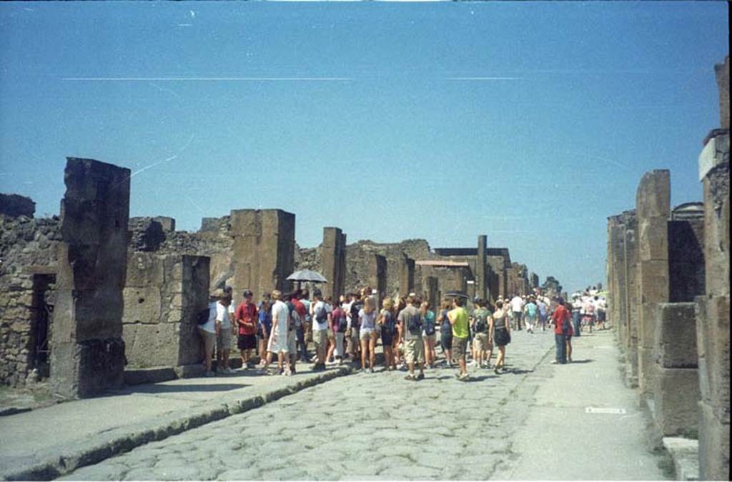 Via dell’Abbondanza, south side. July 2011. Looking west between VIII.5 and VII.13. Photo courtesy of Rick Bauer.