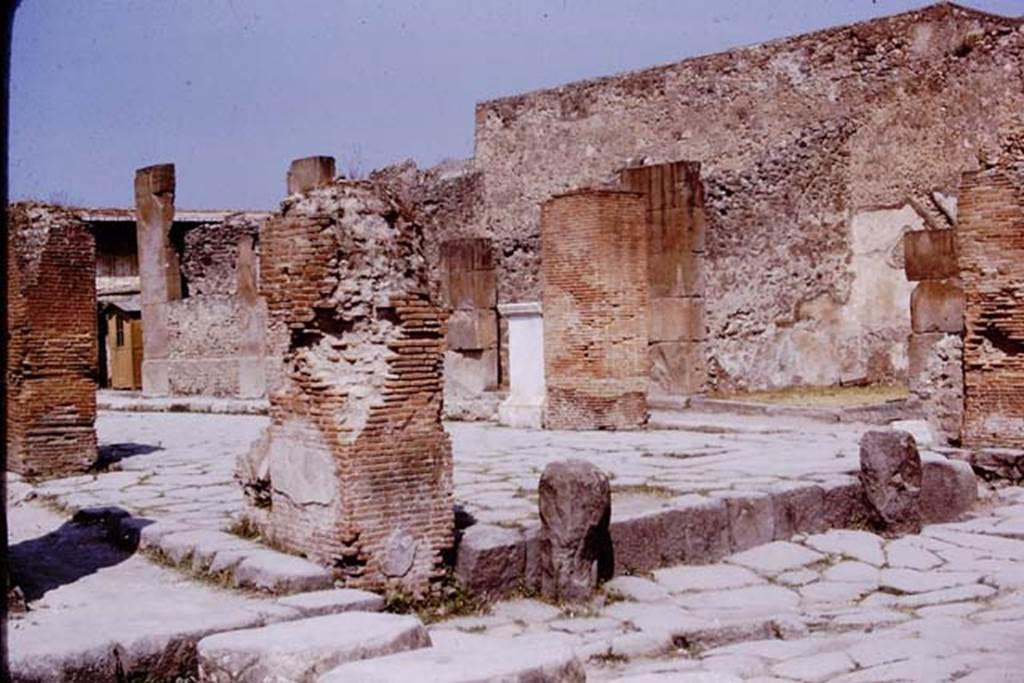 Via dell’Abbondanza, Pompeii. 1975. Looking west from junction with Via Stabiana. Photo by Stanley A. Jashemski.   
Source: The Wilhelmina and Stanley A. Jashemski archive in the University of Maryland Library, Special Collections (See collection page) and made available under the Creative Commons Attribution-Non Commercial License v.4. See Licence and use details. J75f0377
