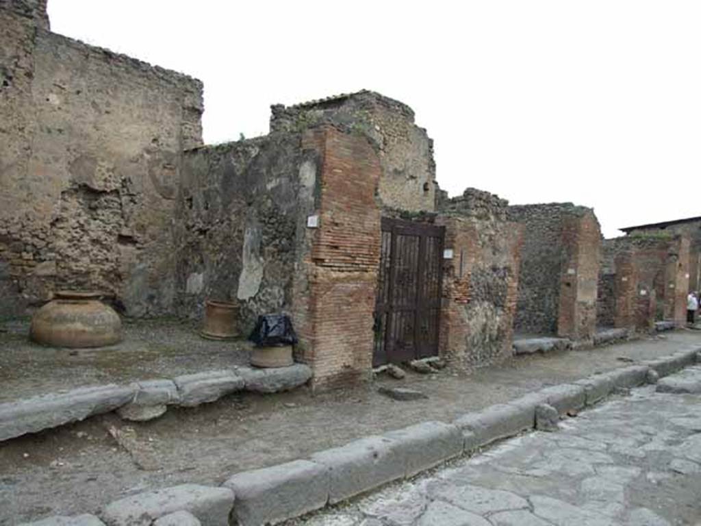 Via della Fortuna, (north side), May 2010. Looking east along VI.10, from VI.10.10 to VI.10.15