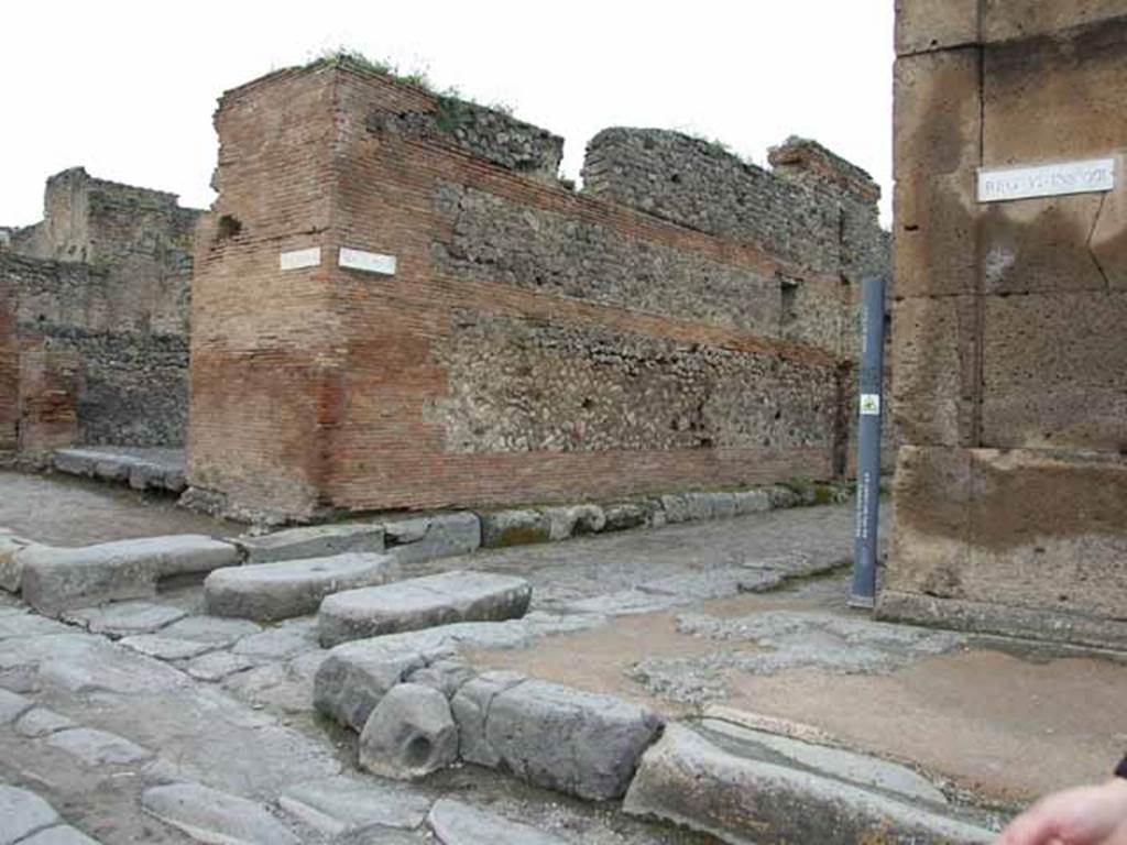 Via della Fortuna, north side, May 2010. Looking west at junction with Vicolo del Fauno, between VI.10 and VI.12.