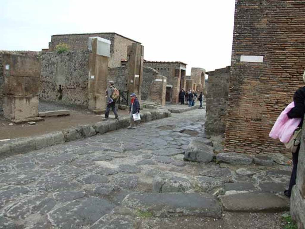 Via delle Terme, north side. May 2010. Looking north-east from the end of Vicolo delle Terme, towards the junction of Vicolo della Fullonica, between VI.6 and VI.8.