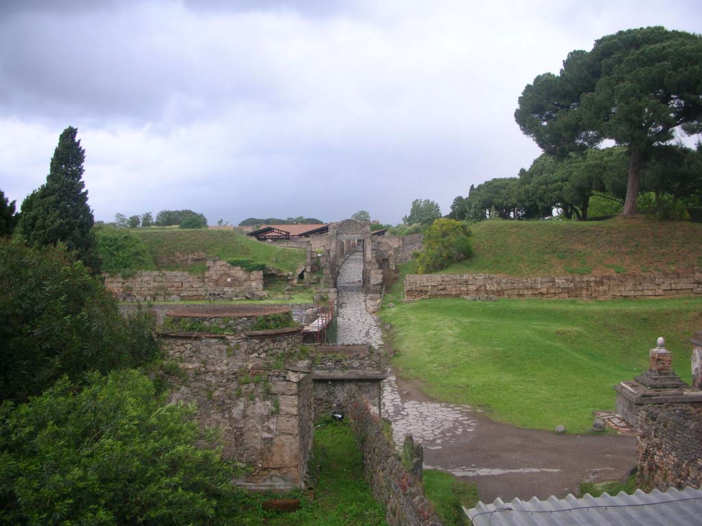 Via delle Tombe, lower right, Pompeii. May 2010. 
Looking north across junction with Via di Nocera and Nocera Gate. Photo courtesy of Ivo van der Graaff.
