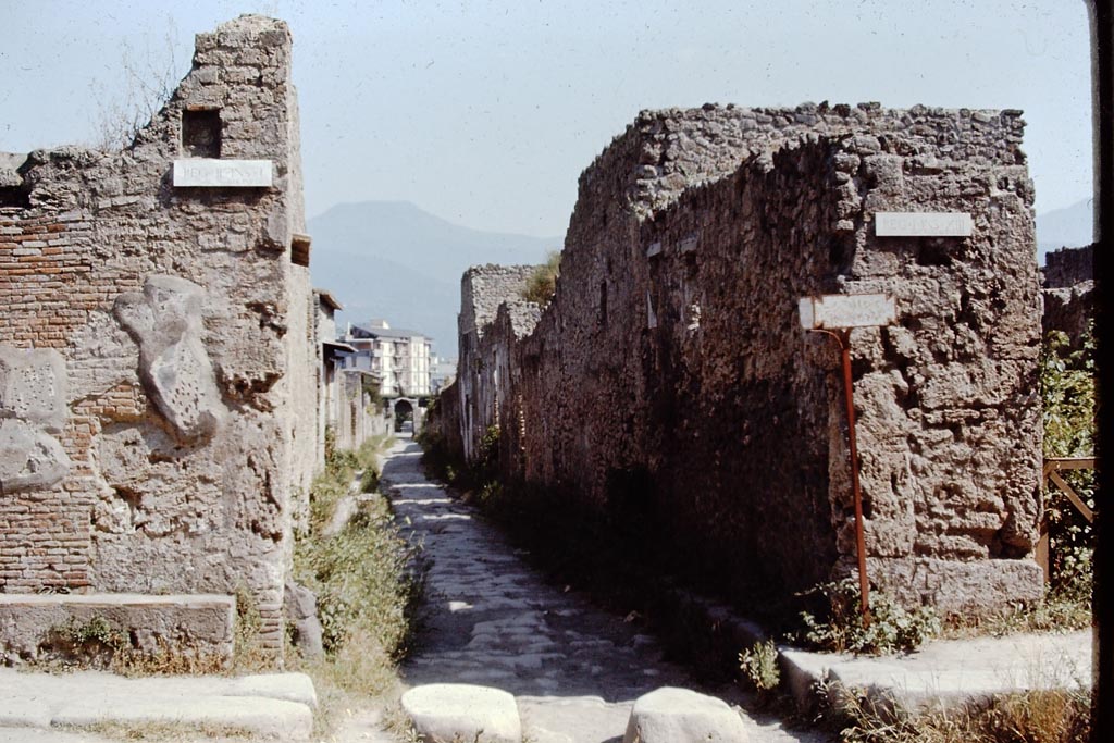 Via di Nocera, Pompeii. 1968.
Looking south between II.1 and I.13, from junction with Via dell’Abbondanza. Photo by Stanley A. Jashemski.
Source: The Wilhelmina and Stanley A. Jashemski archive in the University of Maryland Library, Special Collections (See collection page) and made available under the Creative Commons Attribution-Non Commercial License v.4. See Licence and use details.
J68f0351