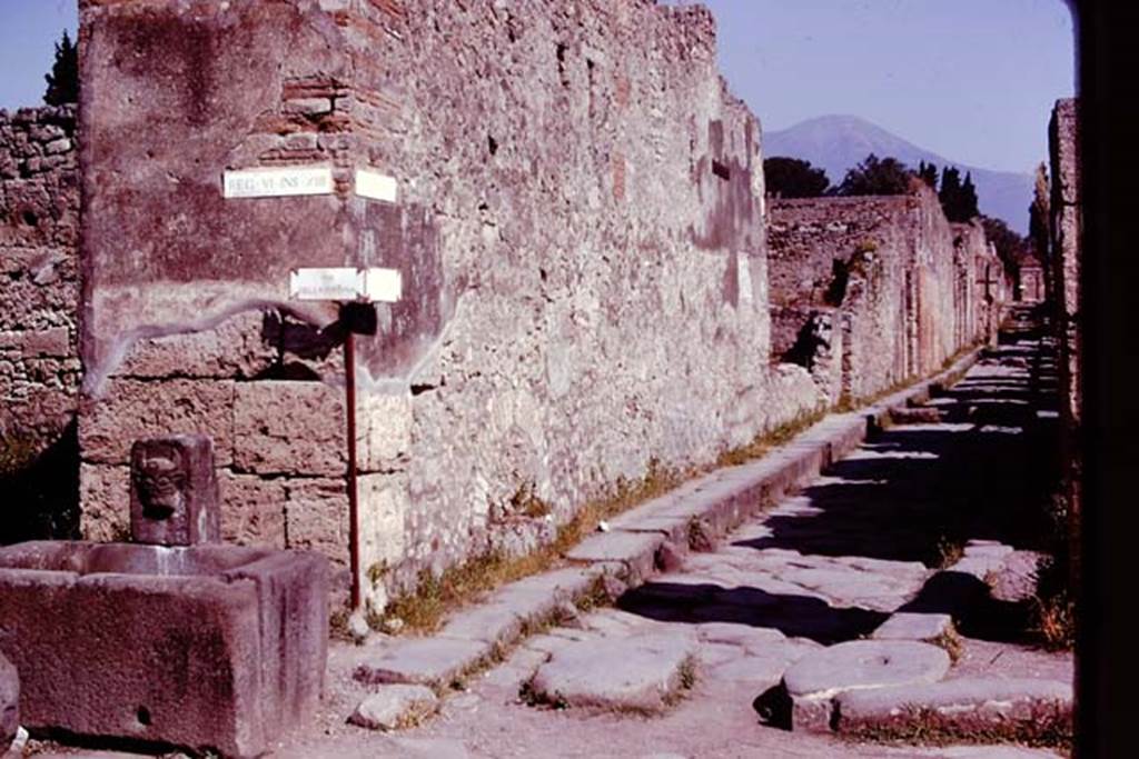 Vicolo dei Vettii between VI.13 and VI.14, Pompeii, 1978. Looking north from Via della Fortuna. Photo by Stanley A. Jashemski.   
Source: The Wilhelmina and Stanley A. Jashemski archive in the University of Maryland Library, Special Collections (See collection page) and made available under the Creative Commons Attribution-Non Commercial License v.4. See Licence and use details. J78f0225
