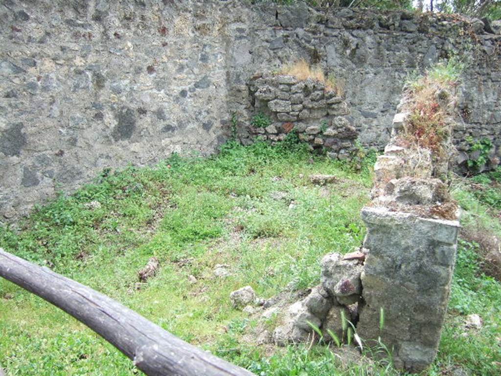 HGE02 Pompeii. May 2006. Tomb of Terentius Felix Maior.
According to Kockel, found in situ on the 15th September 1763, was a marble plaque with an inscription [CIL X 1019]. 
Now in Naples Archaeological Museum.  Inventory number 3879.

According to Epigraphik-Datenbank Clauss/Slaby (See www.manfredclauss.de) this read

T(ito) Terentio T(iti) f(ilio) Men(enia)
Felici Maiori aedil(i)
huic publice locus
datus et HS |(mille)|(mille)
Fabia Probi f(ilia) Sabina uxor      [CIL X 1019].

According to Cooley this translates as:

To Titus Terentius Felix Maior, son of Titus, of the Menenian tribe, aedile. 
To him publicly, a place given and 2,000 sesterces. 
Fabia Sabina, daughter of Probus, his wife.

Also found was a cippus with the inscription T. MAIORI.
See Kockel V., 1983. Die Grabbauten vor dem Herkulaner Tor in Pompeji. Mainz: von Zabern. (p. 115-7,Taf.34).
