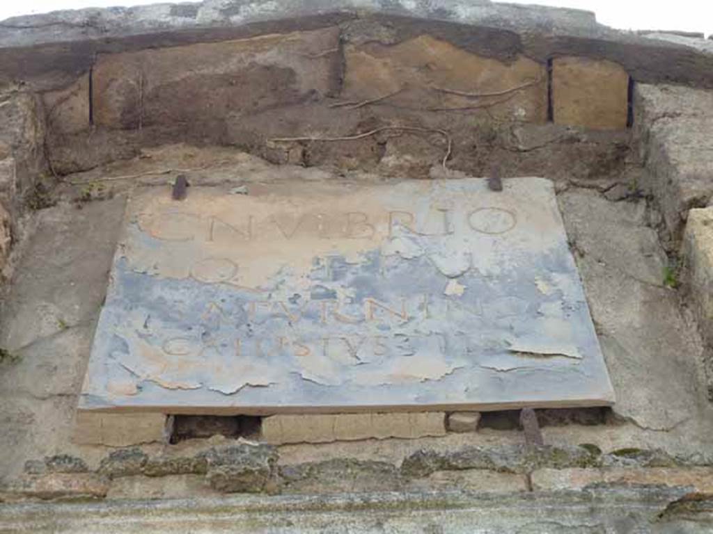 HGW23 Pompeii. May 2010. Marble plaque above entrance.
According to the report of Rocco G. Alcubierre of 14th January 1775 the inscribed marble tablet was found above the door of the tomb which was joined to the Villa of Diomedes.
And at the time it had not been possible to do research inside and nor had it been possible to leave the tablet and it had been sent to the Royal Museum.
See details by Umberto Soldovieri on Epigraphic Database Roma 
According to Kockel the plaque shown here is a copy of the one now in Naples Archaeological Museum. 
See Kockel V., 1983. Die Grabbauten vor dem Herkulaner Tor in Pompeji. Mainz: von Zabern, (p. 109).

