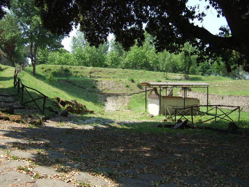 NGOF Pompeii. May 2006. Tomb of M. Obellius Firmus and ancient roadway running past the front, looking west.