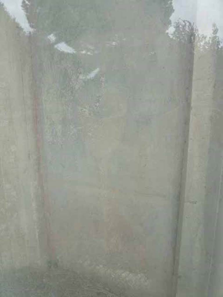 Pompeii Porta Nocera. Tomb 19ES. May 2010.
West side of doorway, remains of painted plaster.