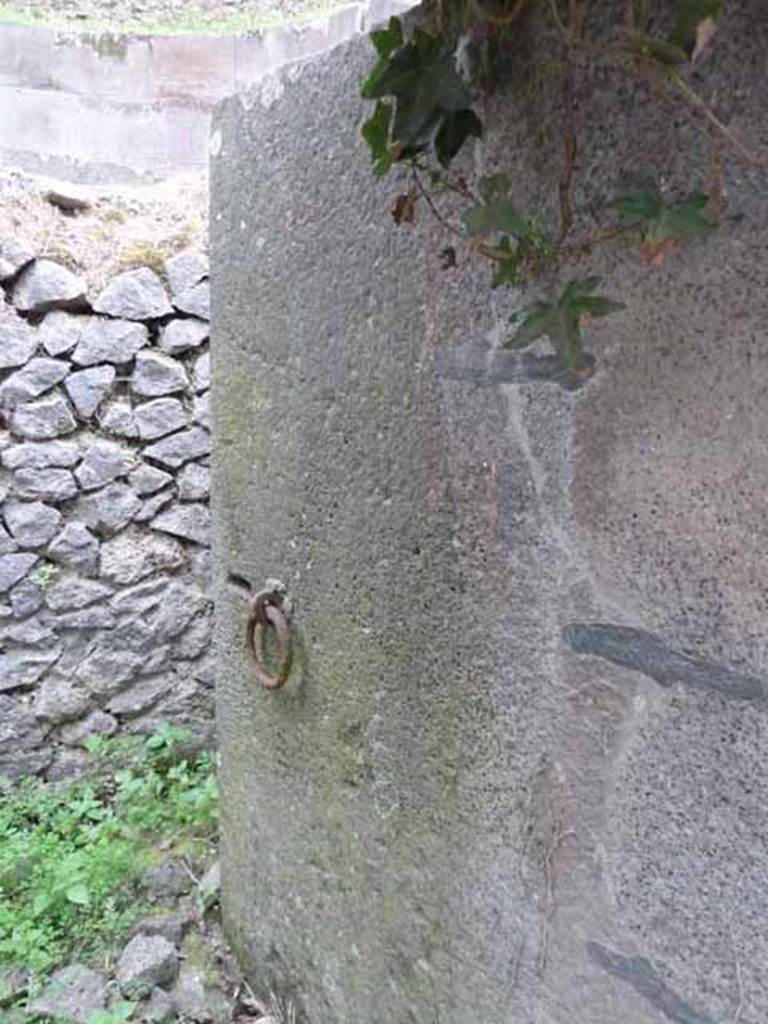 Pompeii Porta Nocera Tomb 11OS. May 2010.
Heavy lava stone door, with iron ring handle.
