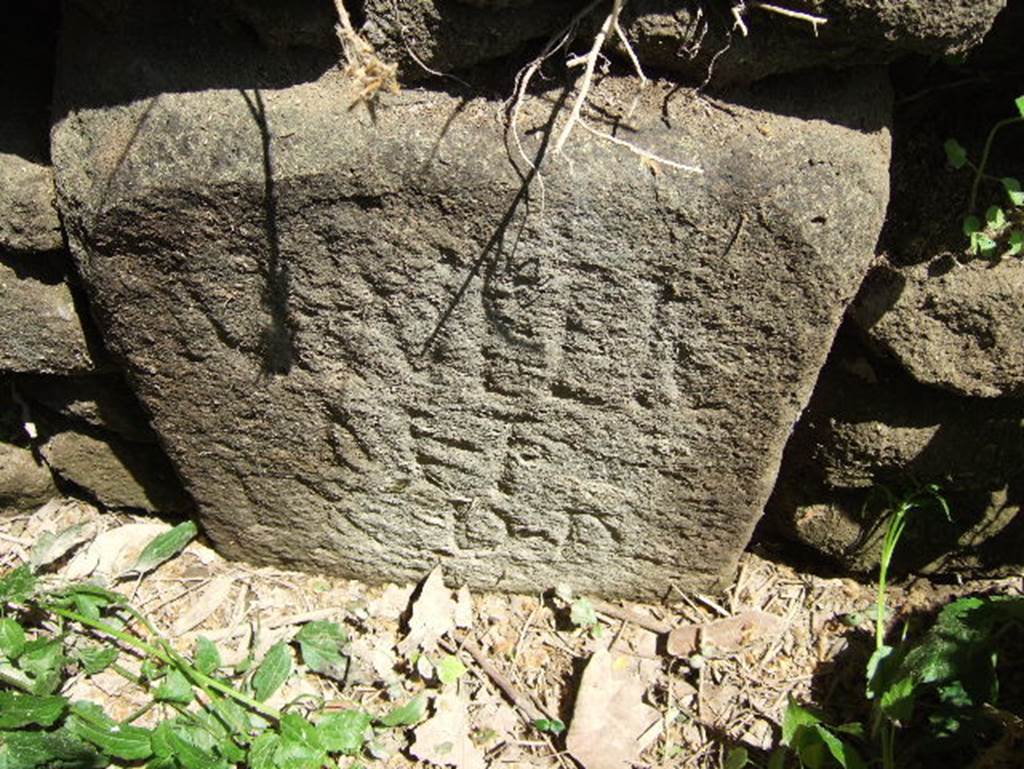 SGH Pompeii. May 2006. According to Mau: The memorial tablet belonging to the monument nearest the gate has disappeared, but two boundary stones at the corners of the lot bear the Latin inscription : 
M. Tullio M. f. ex D(ecurionem) D(ecreto)
'To Marcus Tullius son of Marcus, in accordance with a vote of the city council.' The Tullius named was perhaps the builder of the temple of Fortuna Augusta. See Mau, A., 1907, translated by Kelsey F. W. Pompeii: Its Life and Art. New York: Macmillan. (p.422-3, p.126). The Epigraphik-Datenbank Clauss/Slaby (See www.manfredclauss.de) has the entry as 
M(arco) Tullio / M(arci) f(ilio) / ex d(ecreto) d(ecurionum) [EE-08-01, 00330 = EE-08-01, 00857d]