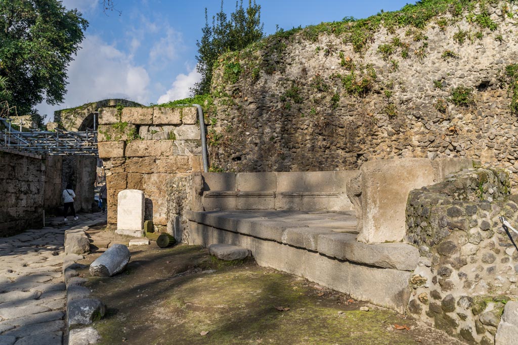 SGD Pompeii. January 2023. Looking north towards the Cippus and the schola tomb, south-east of the Stabian Gate.
A step in front of the tomb is now visible. Photo courtesy of Johannes Eber.