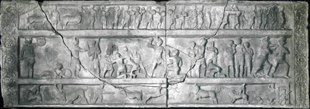 SG7 Pompeii. Gladiatorial relief from tomb at Porta Stabia.
Now in Naples archaeological Museum. Inventory number 6704.
According to Emmerson, this relief measures more than 4 metres long and 1.5 metres high.
See Emmerson A., 2010. Reconstructing the Funerary Landscape at Pompeii's Porta Stabia: Rivista di Studi Pompeiani 21, p. 78, fig. 1.
This has now been suggested it may be part of the tomb at Porta Stabia with the 4 metre long inscription newly discovered in 2017.
That tomb has been suggested to be that of Gnaeus Alleius Nigidius Maius, prolific provider of gladiatorial games and beast hunts in the amphitheatre, like those shown in the relief.
See tomb SG6.