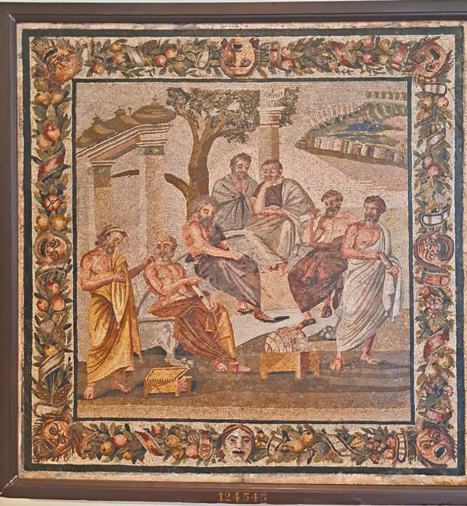 Villa of T. Siminius Stephanus, fondo Masucci-D'Aquino. Mosaic of the Academy of Plato (Dell’accademia Platonica).
Found 14th July 1897 in room F, at a depth of two metres in a layer of ash and not in situ. 
It was embedded in a slab of travertine although traces of wear confirmed its original use in a floor.
Now in Naples Archaeological Museum. Inventory number 124545.
Photo courtesy of Giuseppe Ciaramella. September 2024.
