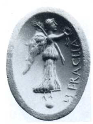 Boscotrecase, Villa of Agrippa Postumus, room “5”. Cameo with winged Vittoria, standing on a globe, with palm frond over shoulder and crown in hand.
On the cameo is the inscription HERACLIA.
Also found was another similar corniola, in which is engraved Minerva armed with helmet, shield and lance.
(The rod is leaning against the shoulder in the oblique direction; of beautiful effect is the movement of the garments in both figures).
See Notizie degli Scavi di Antichità, 1922, p. 463, fig. 4.