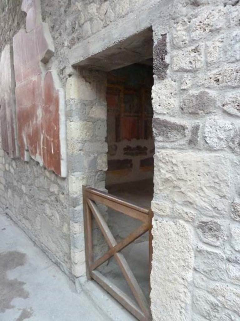 Oplontis, September 2015. Corridor on east side of atrium, north wall with doorway to room 23.